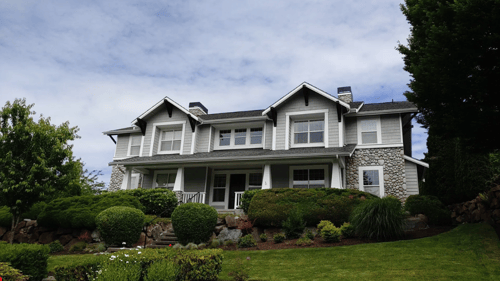 large house painted gray and white