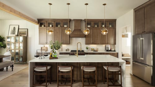 Well-appointed kitchens featuring expansive center islands, premium finishes, and walk-in pantries