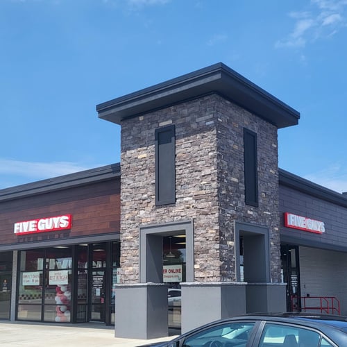 Exterior photograph of the entrance to the Five Guys restaurant at 1948 Ridge Road West in Greece New York.
