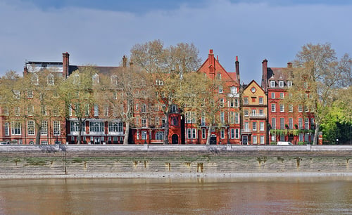Chelsea historic red and orange buildings against the river Thames