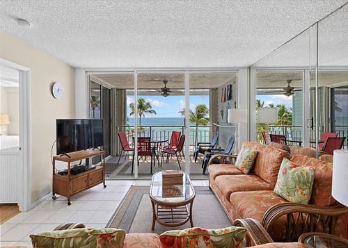 Living room of a Key West vacation rental with an ocean view and patio