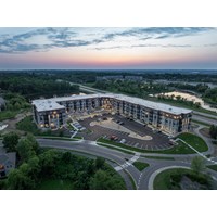 Aerial view of apartment building at sunset at Jeffers Waterfront Apartments, Prior Lake, MN