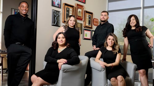 Derrick Spencer State Farm team poses in office