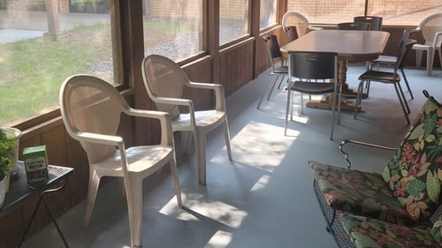 interior photo of the screen-n porch at Duroy Terrace complex