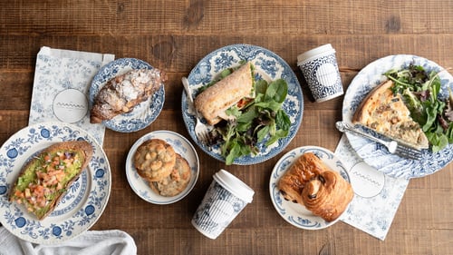 plates with sandwiches, cookies & croissants on them