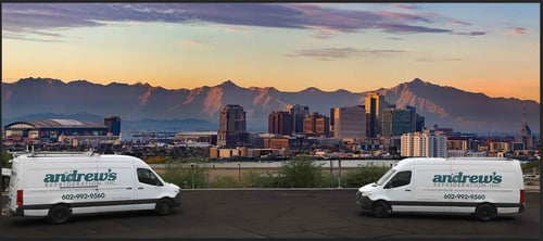 two Andrew's vans in front of the Phoenix skyline