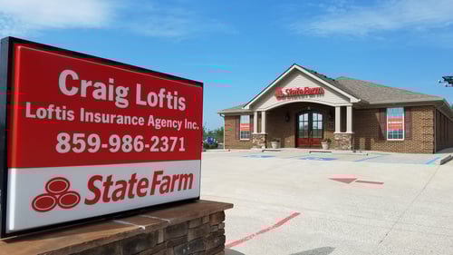 Brown building with red sign