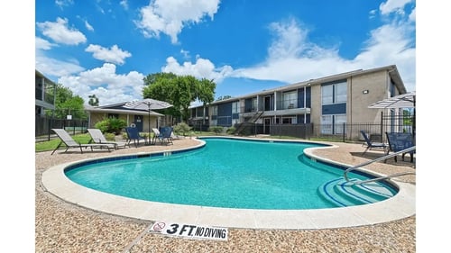 Building with Pool at Pine Creek Apartments, Houston, TX