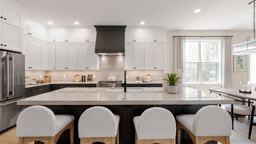 Spacious kitchen boasts a large center island and stainless steel appliances