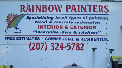 Rainbow Painters vehicle with business information on it