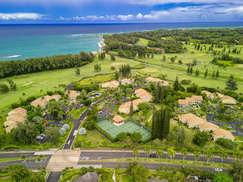 An aerial view of a vacation rental community on Oahu near the ocean