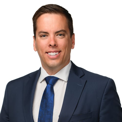 Professional headshot of Matthew Valeriati of RBC Dominion Securities wearing a blue tie, white dress shirt and blue blazer.