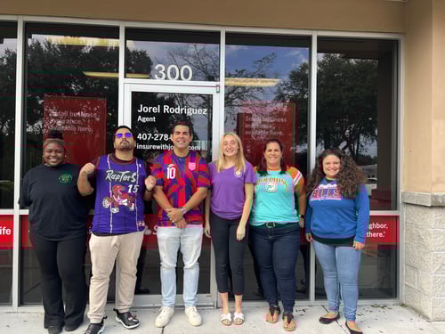 Agent Jorel with Team posing in front of Agency in Jerseys