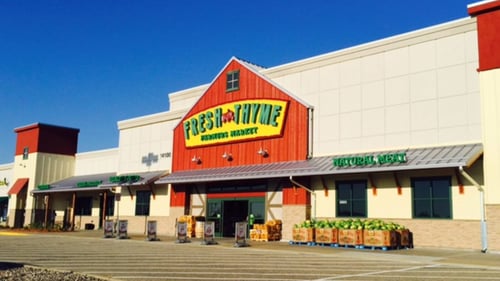 Produce lining the front entrance of Fresh Thyme Farmers Market