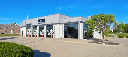 Exterior of Collision Leaders of Harrisonville Collision Center in Harrisonville, MO, showing the shop's modern building, service bays, and entrance. Demonstrates the shop’s professional and well-equipped facility.