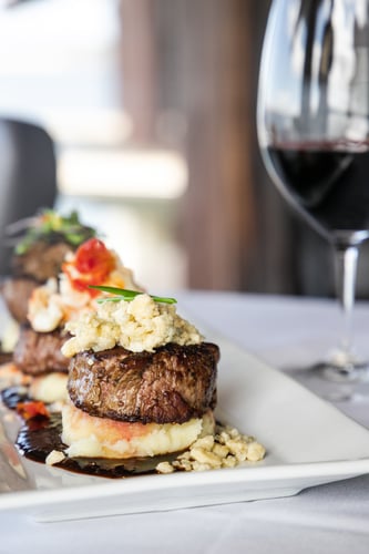 Island Prime's signature dishes include the Island Prime Filet Trio, Seared Blackened Tuna and Chicken “Under a Brick”.