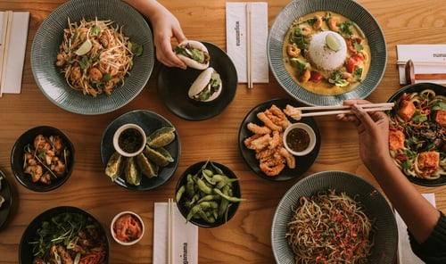 a variety of dishes on a table at wagamama