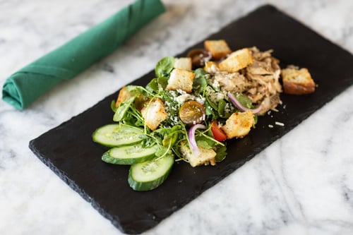Colorful garden salad with cherry tomatoes and feta cheese.