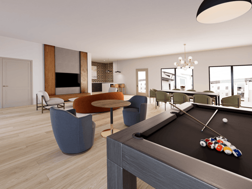 A billiard table is in the middle of a room with a chair and a couch.