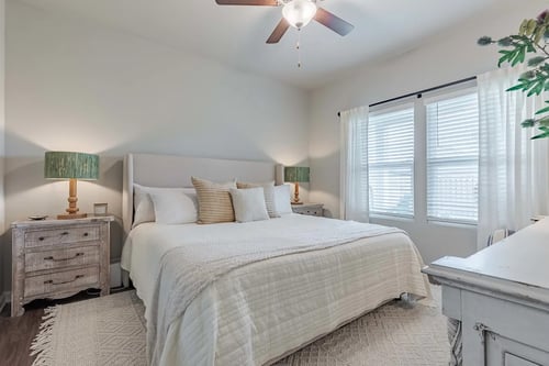 Outpost Orchard bedroom with king bed, neutral tones, and natural light.