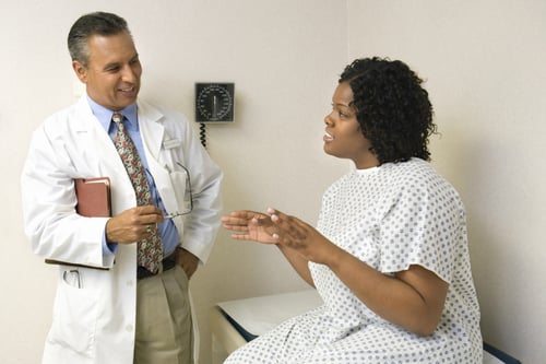 Patient talking to USA Fibroid Centers doctor
