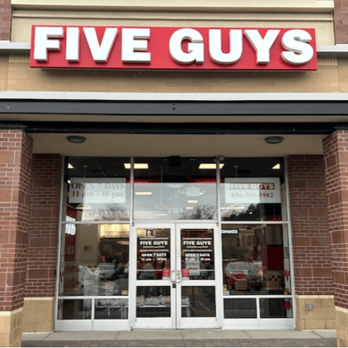 Exterior photograph of the Five Guys restaurant at 2180 N. 2nd Street in Millville New Jersey.