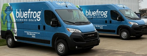 Two Bluefrog Plumbing + Drain of Cleveland West service vans.