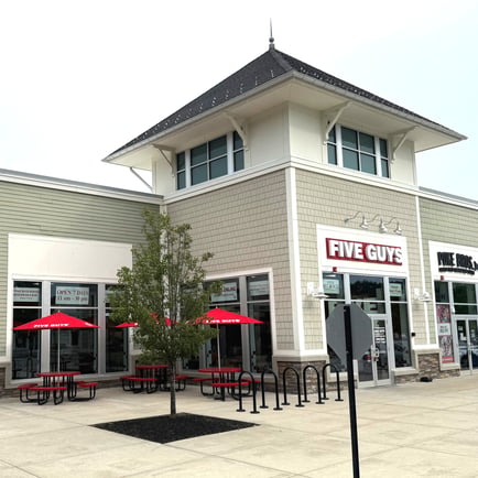 Exterior photograph of the Five Guys restaurant at 158 Great Road in Bedford Massachusetts.