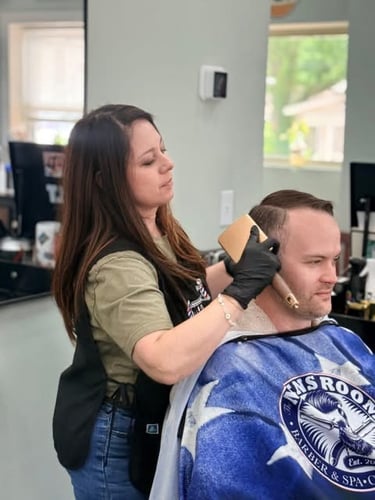 If you’re looking for the best barber shop in Hoschton, GA, look no further than The Men's Room Barber & Spa. Our barbershop offers haircuts, shaving services, facials, and waxing services. We provide a comfortable and relaxing environment so while you’re waiting, enjoy a cup of coffee or sit in one of our massage chairs. When you come in to get a haircut, you can be sure that you will be walking out with confidence. Call our barbershop today to schedule an appointment!