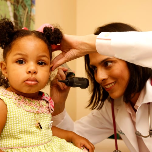 Dr. Pradhan with a patient at Cook Children's Pediatrics Fort Worth - Henderson