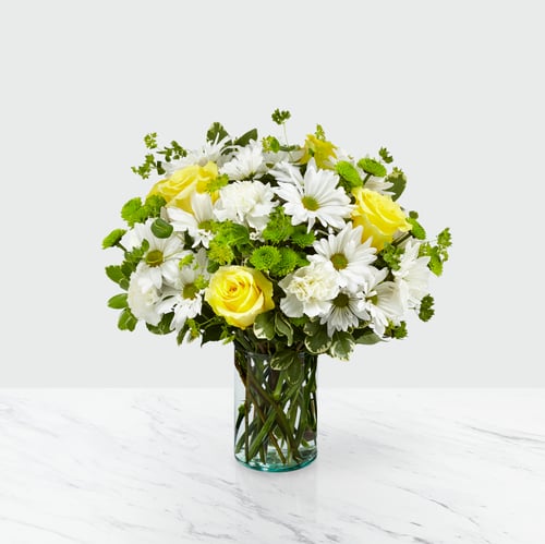 Happy Day Bouquet – A Rose & Daisy Ensemble to Brighten Any Day! White daisies & yellow roses create the best rose and daisy bouquet for weddings, gifts & celebrations. Order daisy bouquet online from the best florists in Lansing and enjoy fast same day delivery from lansing gardens!