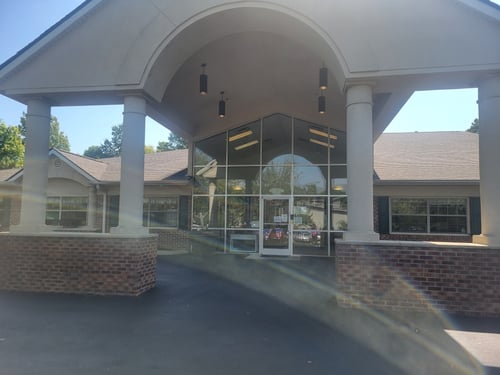 Front view of the daycare building with a welcoming entrance, designed to create a safe and nurturing environment for children.
