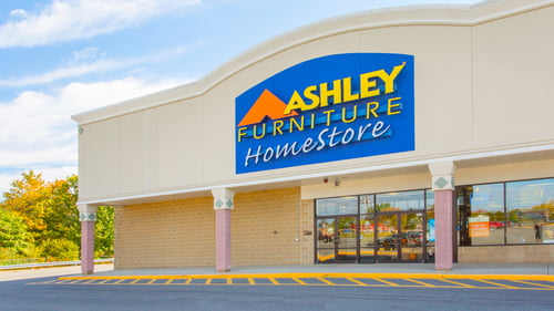 Front exterior of Ashley Furniture on a sunny day at Wallkill Plaza shopping center
