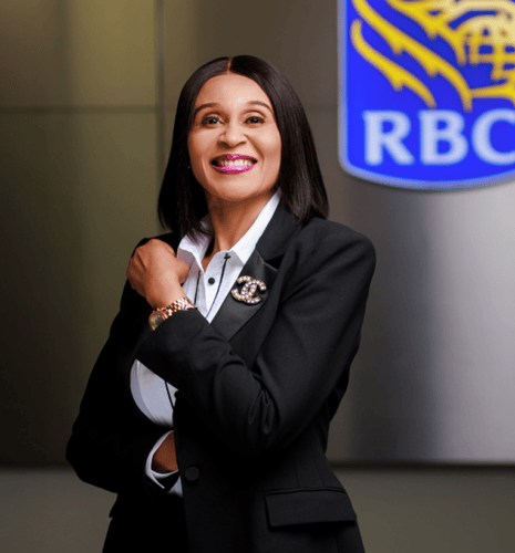 Uju Ukpeh in front of the RBC sign.
