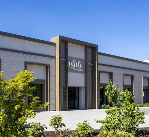 the 1916 company's storefront, overlooking lush green landscaping at the ardmore location in suburban square