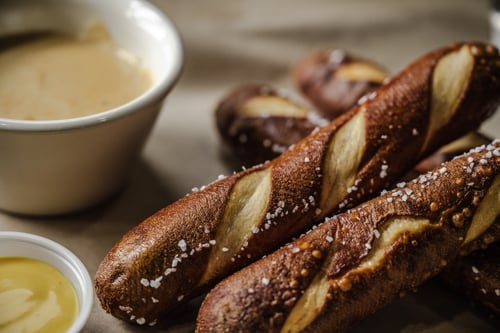 Warm salted pretzel sticks served with house-made beer cheese dipping sauce.