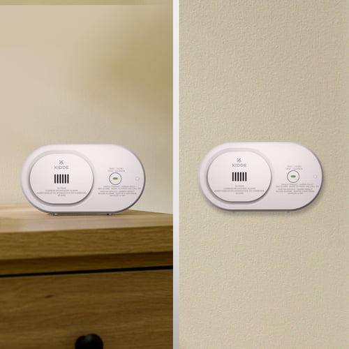 Image of the same alarm, installed on the wall or sitting on a table.