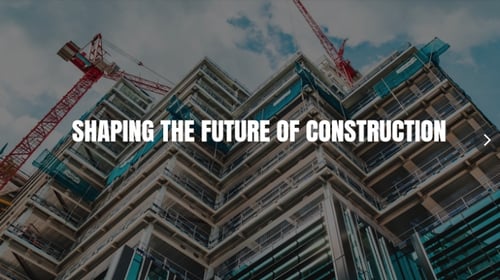 Multi-story building under construction with red tower cranes and text reading Shaping the Future of Construction.
