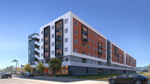 A red, white, and grey building with 6 stories and a blue sky at Tellus on Carson Apartments, Torrance, CA, 90502