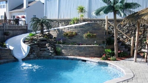 custom fiberglass waterslide into inground pool