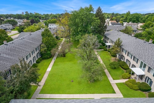 Overhead view of green courtyard surrounded by apartment buildings at Cambridge Square in Southfield, Michigan.