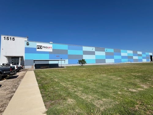 Image of ProLift's DFW branch from outside...large rectangular building with ProLift sign on the side..