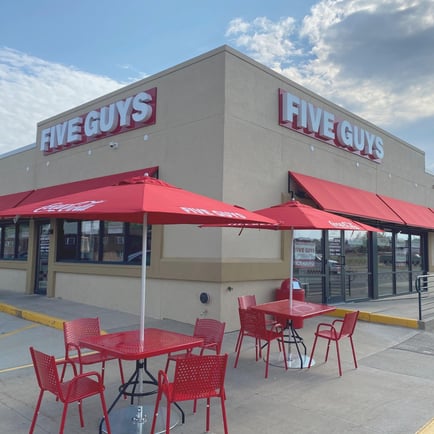 Exterior photograph of the Five Guys restaurant at 6406 University Avenue in Cedar Falls Iowa.