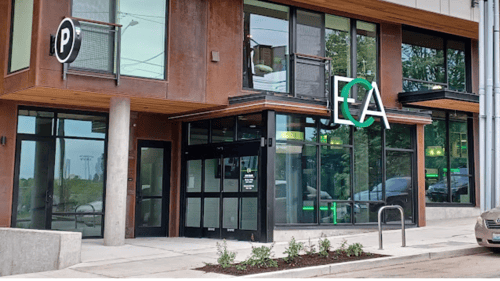 Modern entrance of Emerald City Athletics' Columbia City location in Seattle, inviting members to enjoy our well-equipped fitness center designed for every fitness goal.