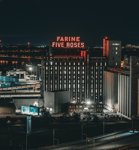 Farine Five Roses sign at night.