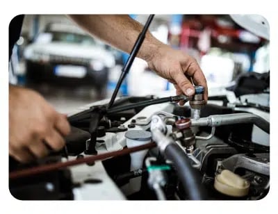 ASE-certified technician performing vehicle air conditioning repair and AC system diagnostics at Auto-Lab® in Southgate, MI.