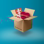 An open shipping box with gifts.