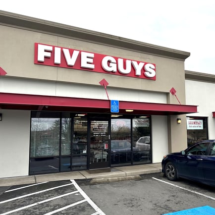 Exterior photograph of the Five Guys restaurant at 3266 Gateway Boulevard in Springfield Oregon.