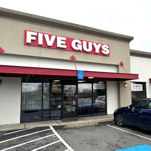 Exterior photograph of the Five Guys restaurant at 3266 Gateway Boulevard in Springfield Oregon.