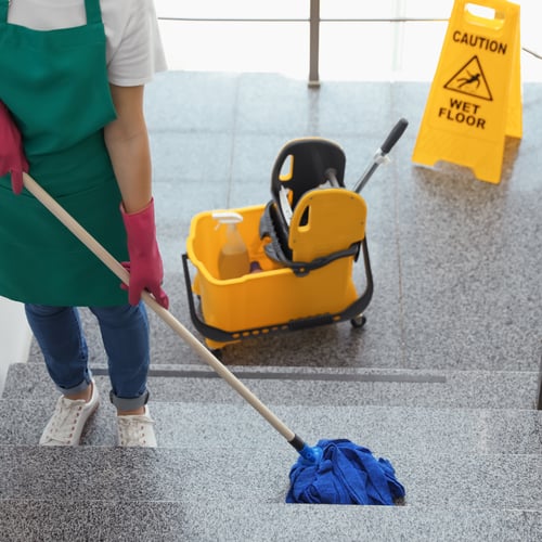 Janitorial team cleaning a commercial office